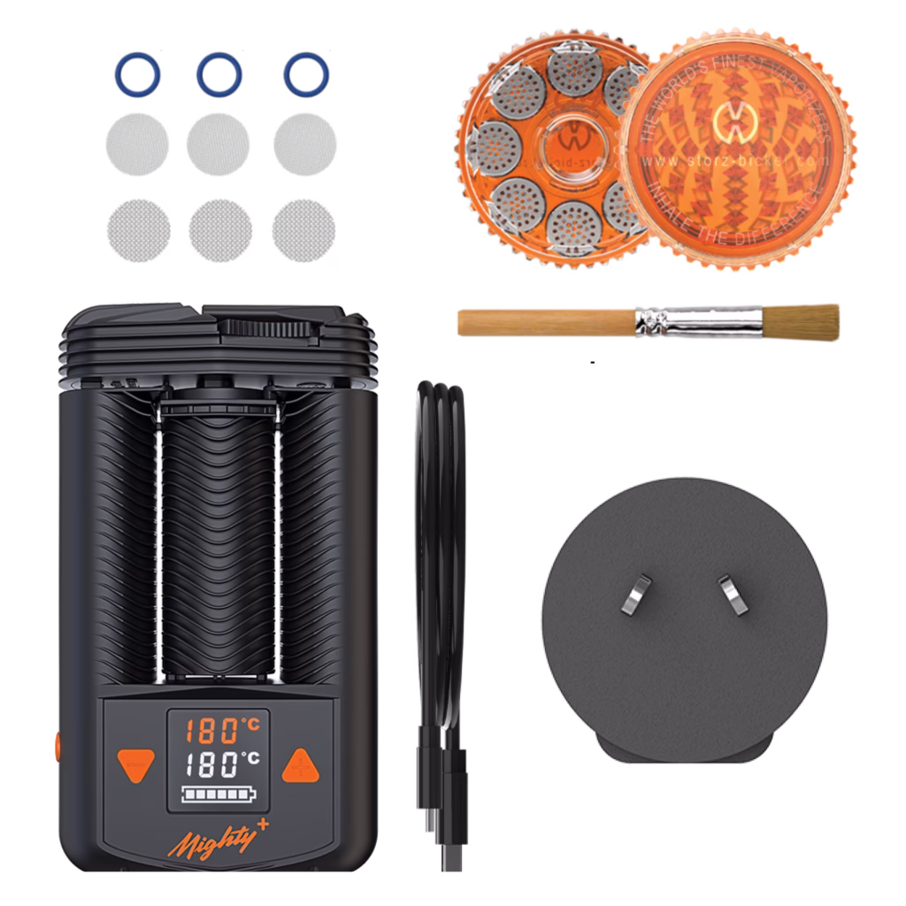 Mighty+ vaporiser kit with included accessories, featuring the Mighty+ vaporiser, charging cable, dosing capsules, and cleaning brush