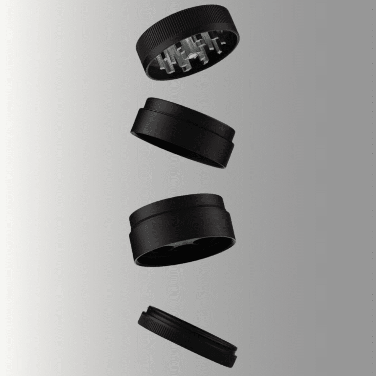 A matte black four-piece herb grinder shown as an exploded view with all sections separated and floating vertically against a grey gradient background. From top to bottom: the lid with grinding teeth visible inside, the upper grinding chamber, the lower collection chamber with a mesh screen, and the flat catch tray at the bottom.
